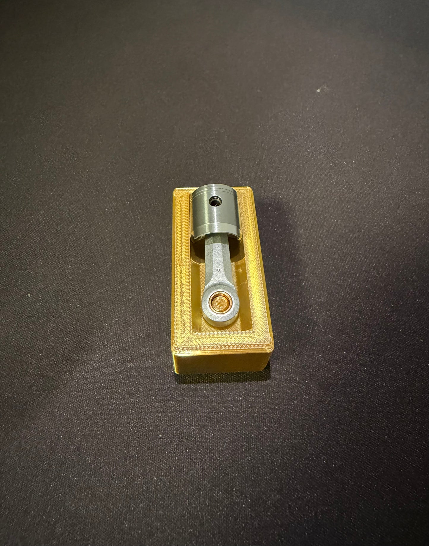 GOLDEN  PISTON HOLDER